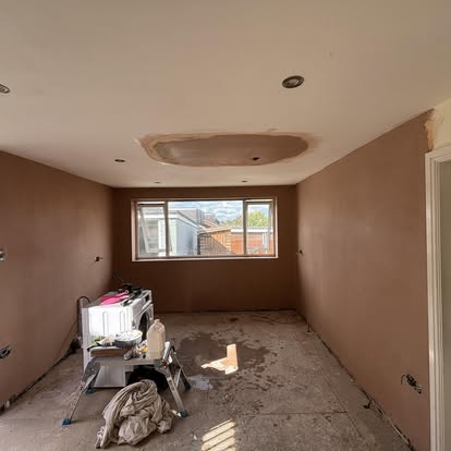 Plaster repair blended into existing wall